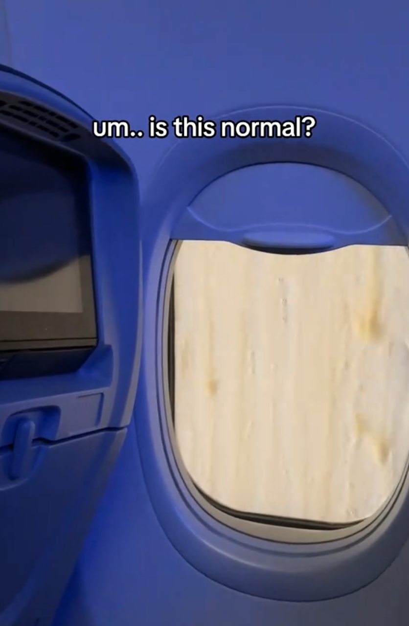 Brownish liquid sliding down plane window